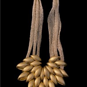 Contemporary, beautiful gold fashion necklace and matching earrings